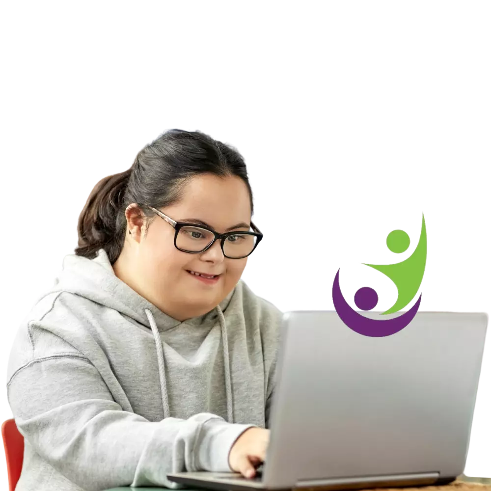 Disabled girl with down syndrome smiling while using laptop
