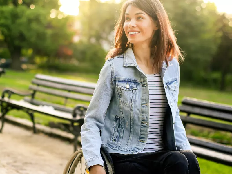 Happy woman smiling in wheelchair