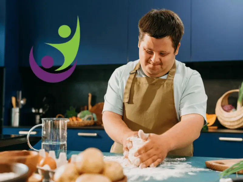 Disabled man with down syndrome in cooking class
